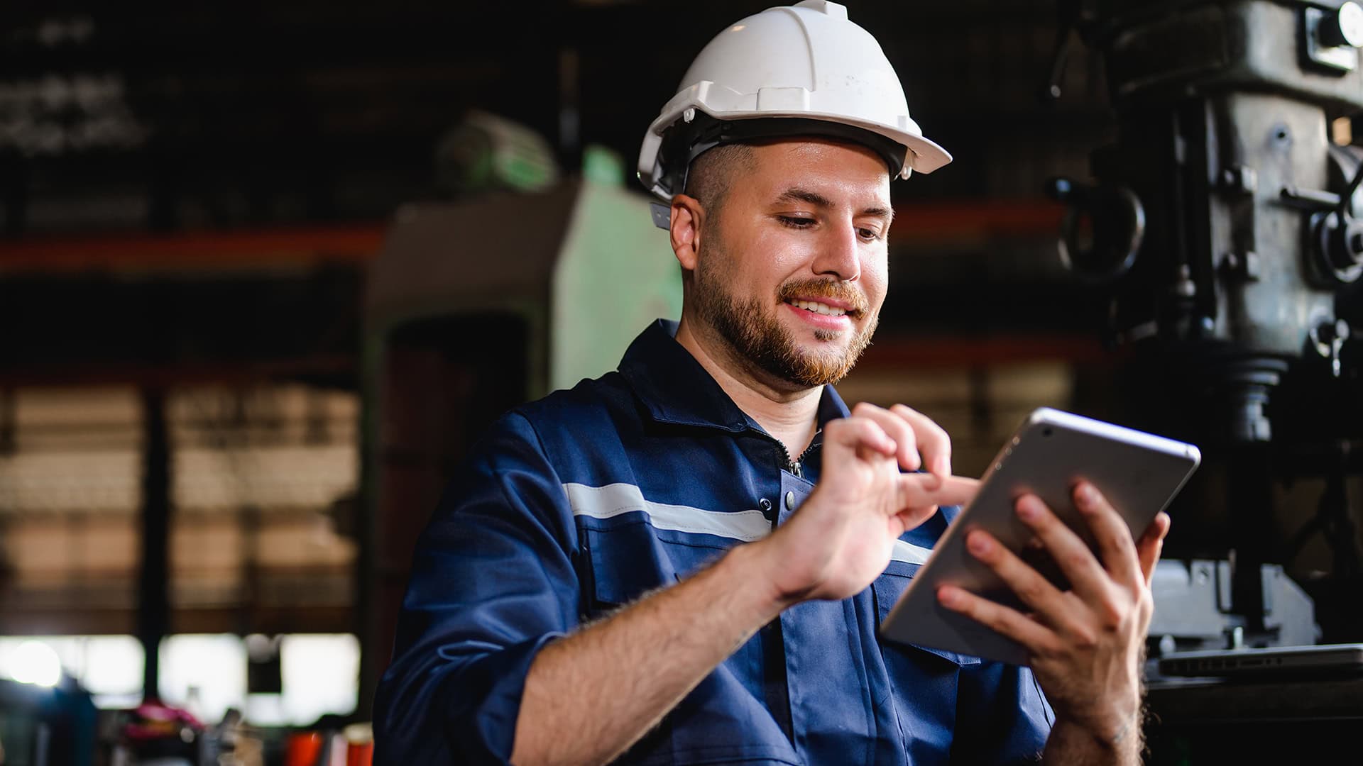Engineer reviewing certification requirements on the shop floor