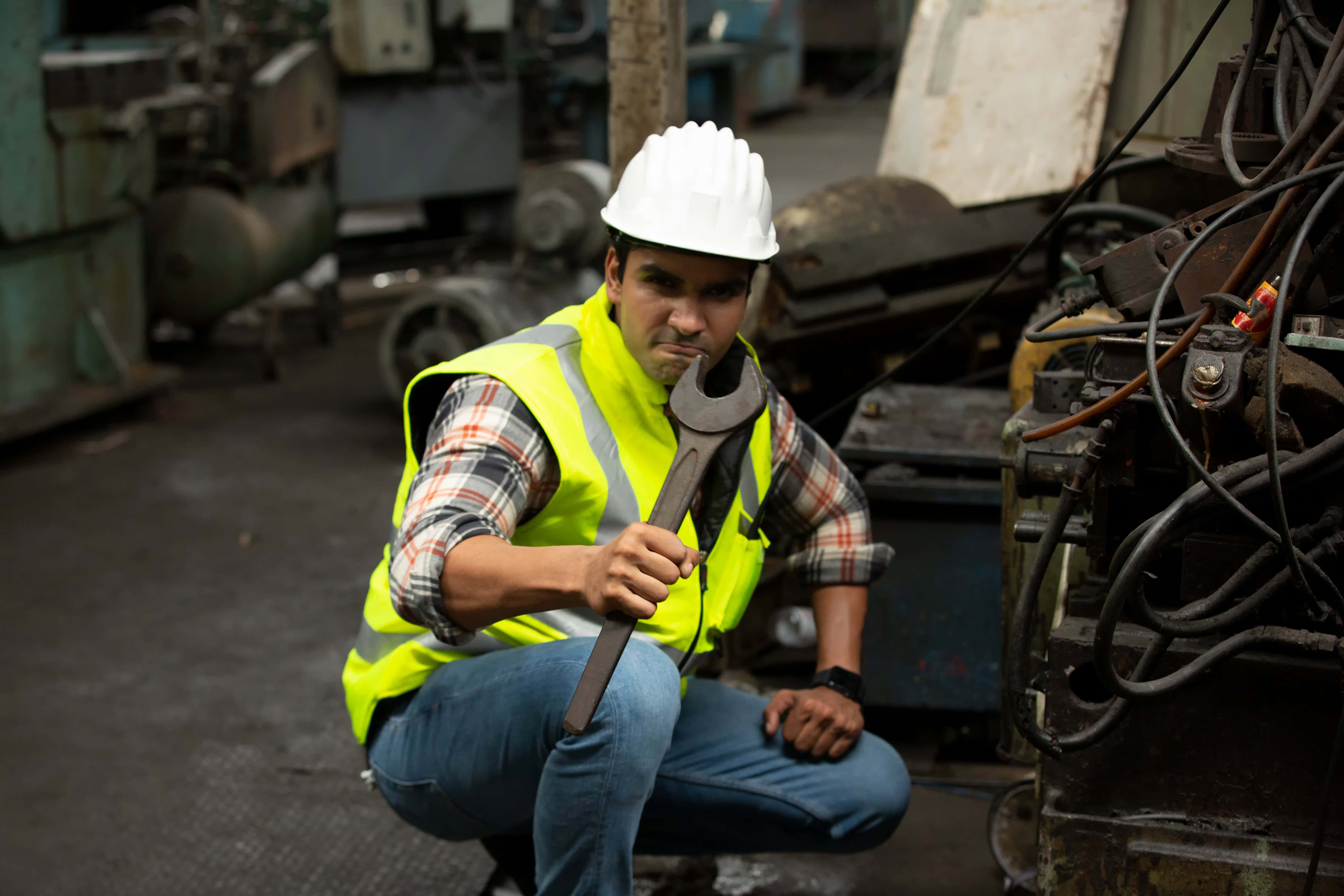 Metalwork industry worker operating shop equipment